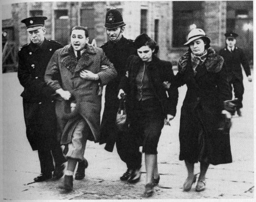 Jewish refugees from Czechoslovakia being marched away by British police at Croydon airport in March 1939